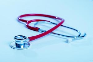 Stethoscope on blue background photo