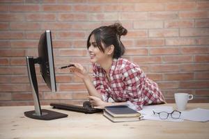 Beautiful woman is working in home office photo