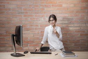 Beautiful woman is working in home office photo