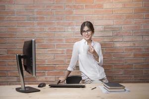 Beautiful woman is working in home office photo