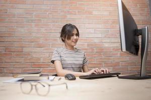 Beautiful woman is working in home office photo