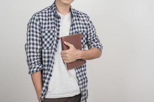 Close up of boy with a book photo