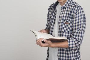 Close up of boy with a book photo