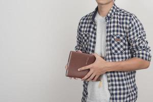 Close up of boy with a book photo