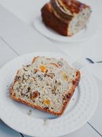 Homemade banana bread with dried fruits and walnuts. photo