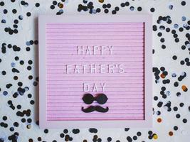 Happy Father's day. Greeting card with mustache, glasses, and confetti, holiday concept. Father's day concept. photo