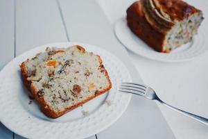 Homemade banana bread with dried fruits and walnuts. photo