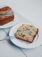 Homemade banana bread with dried fruits and walnuts. photo