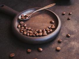 Roasted coffee beans on dark background photo