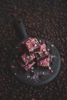 Homemade chocolate fudge with strawberries and pine nuts photo