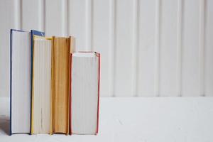 Stacks of educational books on a white background. Education concept. photo