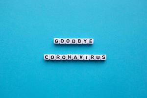 Goodbye Coronavirus, on a blue background photo