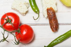 Raw rustic meal farm fresh vegetables cheese and cabbage photo