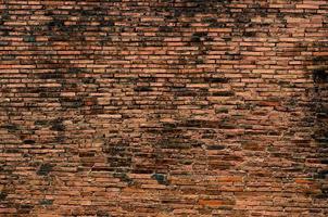 Ladrillo, fondo, pared de ladrillo antiguo, textura antigua de bloques de piedra roja closeup foto