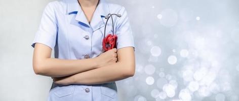 Female doctor with tools, white background photo