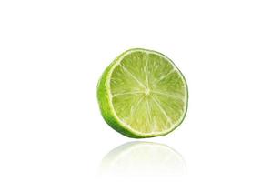 Piece of lime, slice, isolated on white background with drop shadow. photo