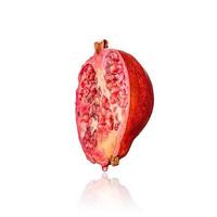 Half of pomegranate fruit, slice, isolated on white background with drop shadow. photo