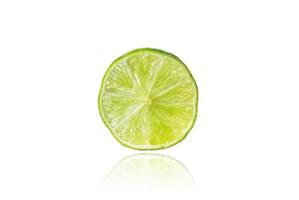 Piece of lime, slice, isolated on white background with drop shadow. photo