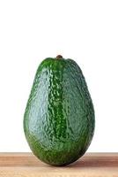 Avocado fruit on wooden table with isolated white background. photo