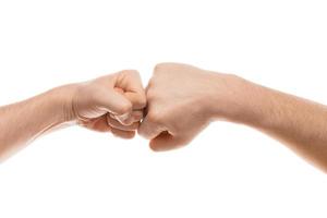 Two fists hitting each other hand gesture. Isolated on white background. photo