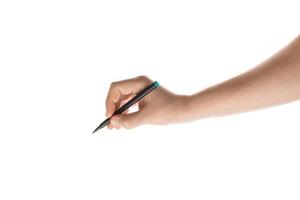 Male hand writing with the marker or felt pen. Isolated on white background. photo