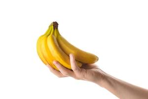Man holding bunch of bananas in his hand. Isolated on white background. photo