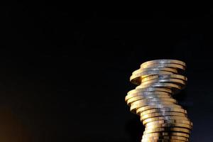 saving money concept, stacking coins on table background, Advertising coins of finance and banking, macro coins photo