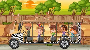 Safari at sunset scene with kids watching kangaroo group vector