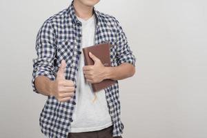 Close up of boy with a book photo