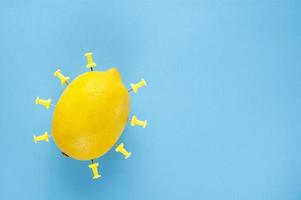 A simple creative object made of lemon and paper pins. Minimalist concept with free copy paste space for text photo