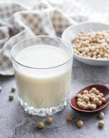 Soy milk and soy on the table photo