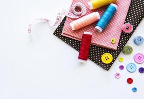 Sewing accessories on a white background photo