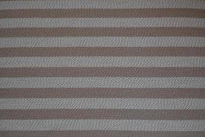 Rough texture background in beige and dirty white, made with horizontal stripes in brown tones photo