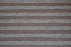 Rough texture background in beige and dirty white, made with horizontal stripes in brown tones photo