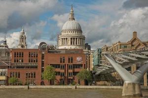 St. Pauls Cathedral and the Millennium Bridge in London, United Kingdom photo