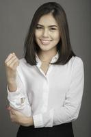 Business woman in white shirt on grey background photo