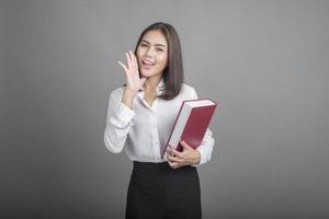 Business woman in white shirt on grey background photo