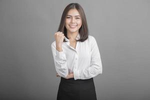 Business woman in white shirt on grey background photo