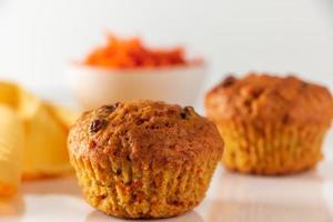 Pumpkin muffins on a white background. Homemade vegetable cakes for a healthy diet. Seasonal autumn baking.