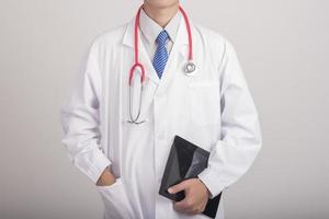 Medicine doctor hand holding stethoscope and working with modern medical icons photo