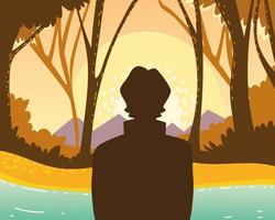 man in the forest looking at nature vector