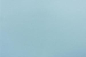 Blue paper with soft texture. Simple background. photo
