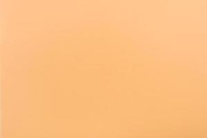 Orange paper with soft texture. Simple background. photo