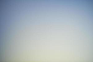 Abstract blue and yellow background with soft gradient and texture. photo