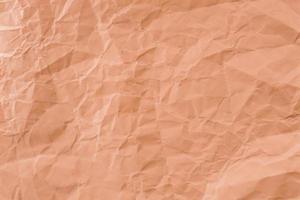 Crumpled Orange paper with soft texture. Simple background. photo