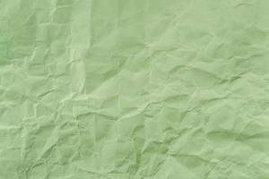 Crumpled Green paper with soft texture. Simple background. photo