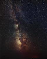 Milky Way galaxy over the rocky seacoast. photo