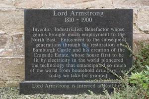 Stone in memory for Lord Armstrong the first baron of Bamburgh Castle in Northumberland, England, UK photo