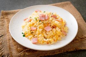 Homemade fried rice with ham on plate photo