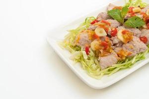 Spicy pork salad or boiled pork with lime garlic and chili sauce photo